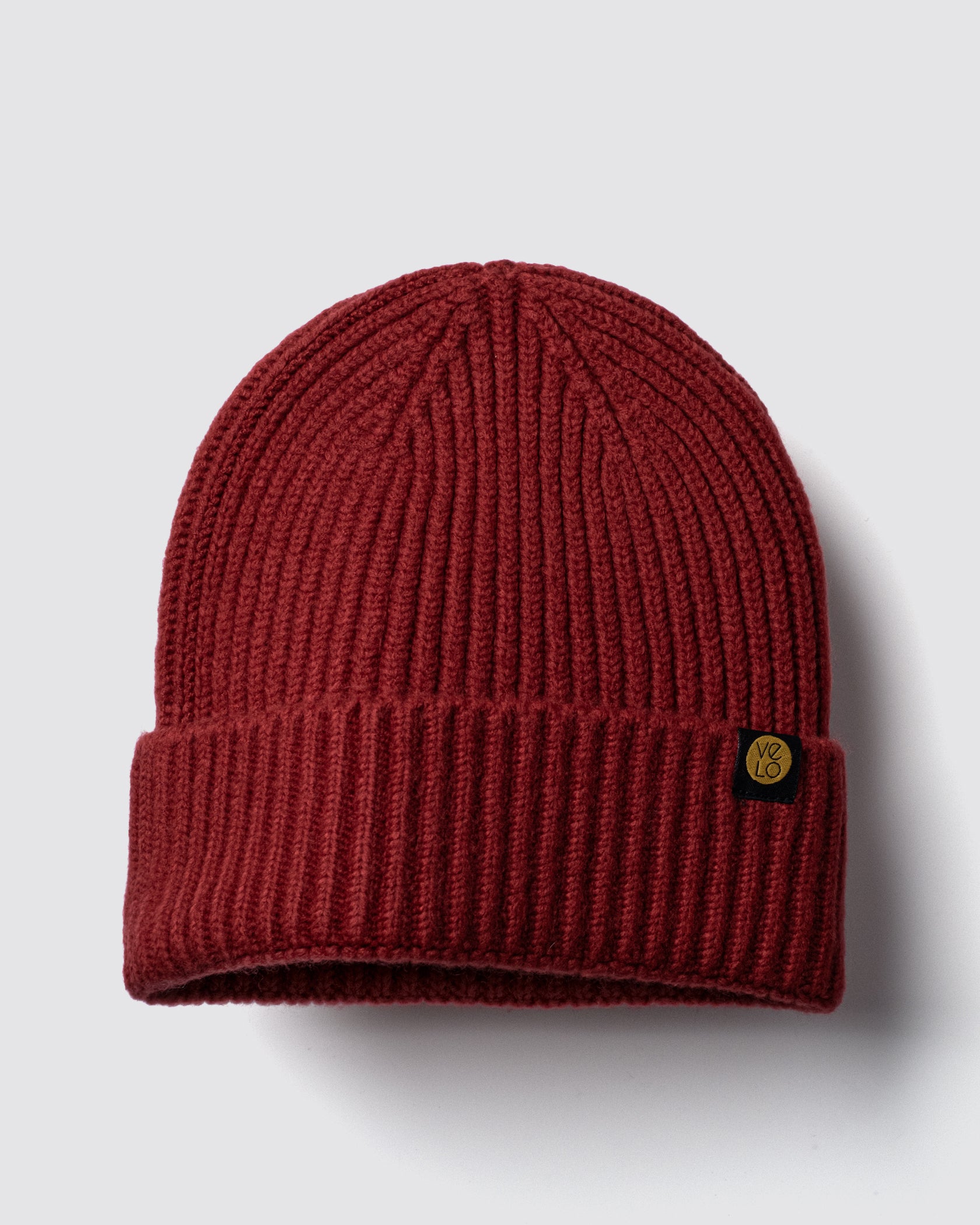 Dark Red Lux Beanie on a light gray background