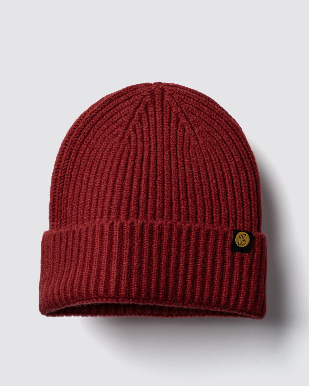 Dark Red Lux Beanie on a light gray background