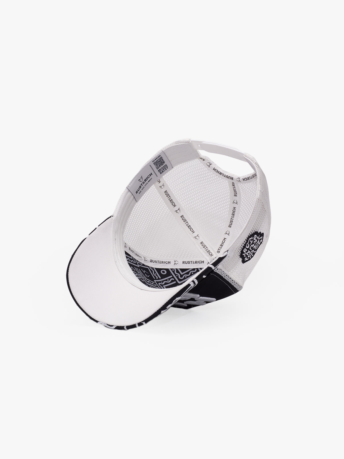 White cap with black patterns on a white background