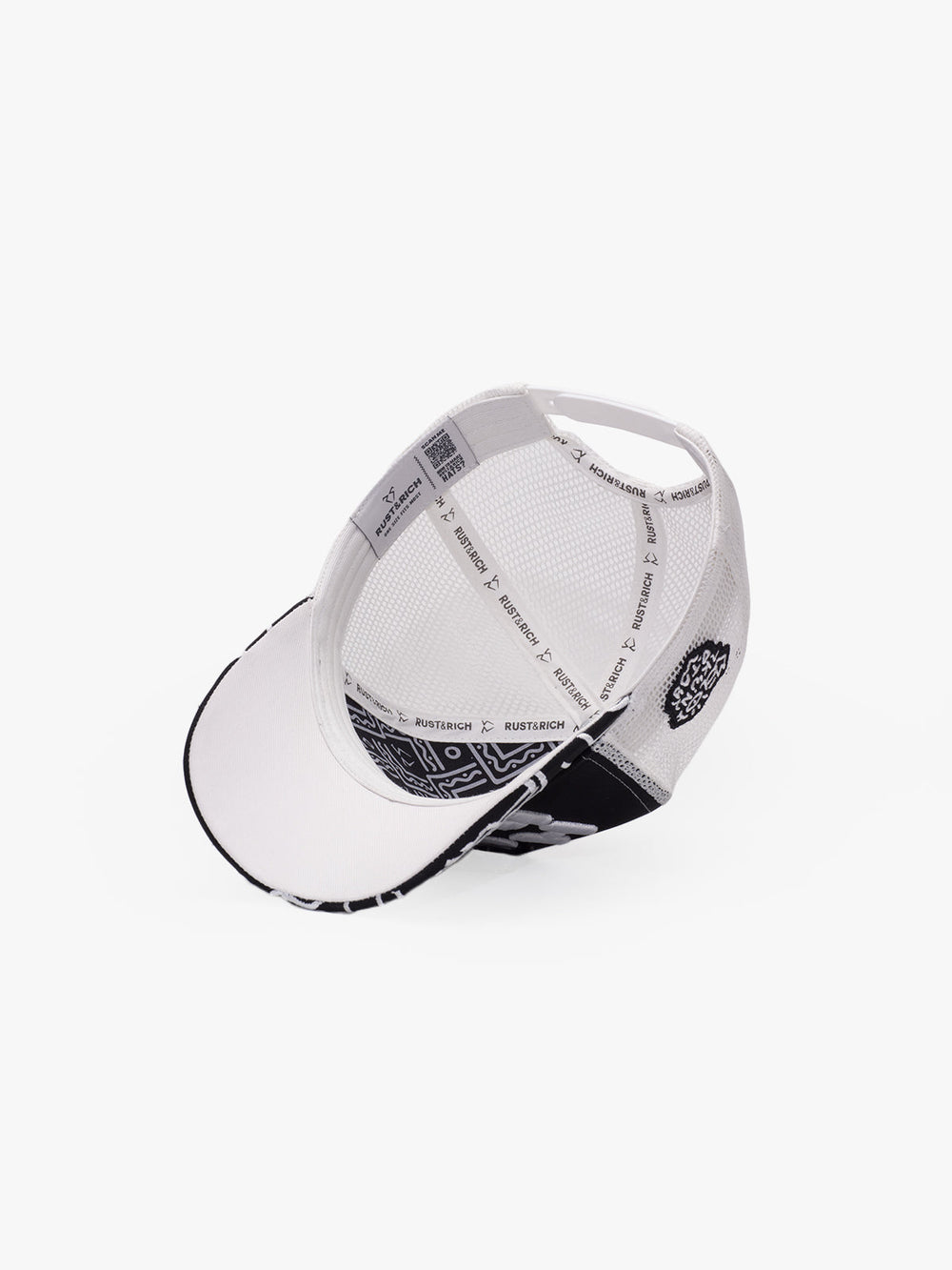 White cap with black patterns on a white background