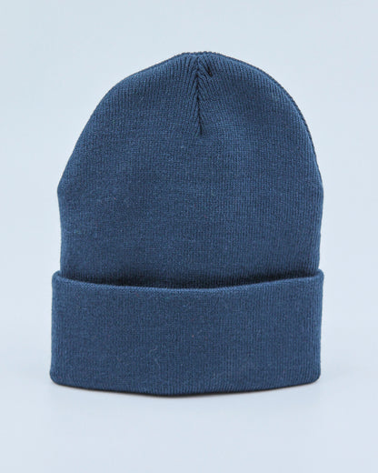 Dusty navy blue beanie on a light blue background