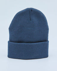 Dusty navy blue beanie on a light blue background