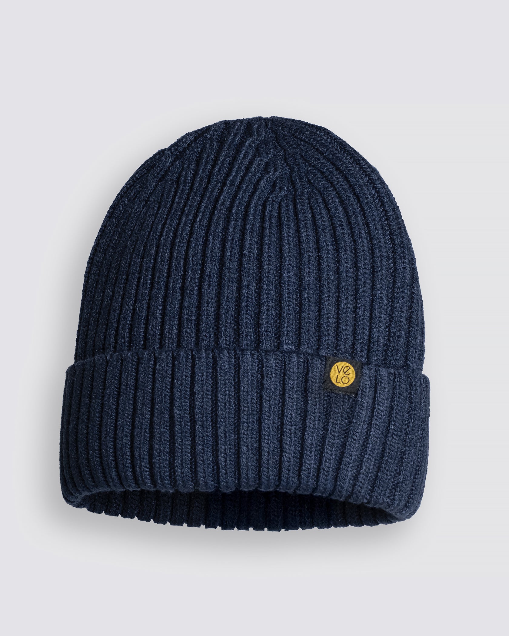 Dusty Navy Classic Beanie with a logo on a light gray background
