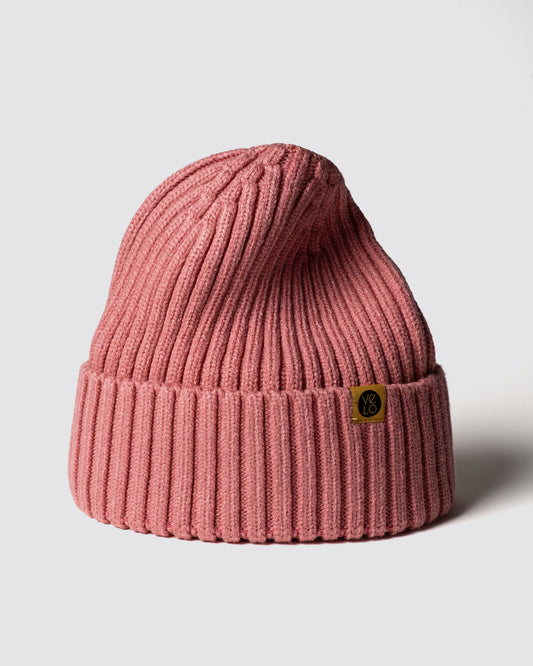 Dusty Pink Classic Beanie with a brand logo on a light gray background
