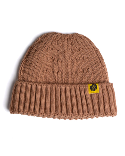 dusty pink fisherman beanie on a white background