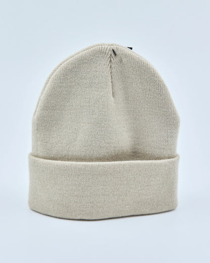 Ecru white beanie on a light gray background