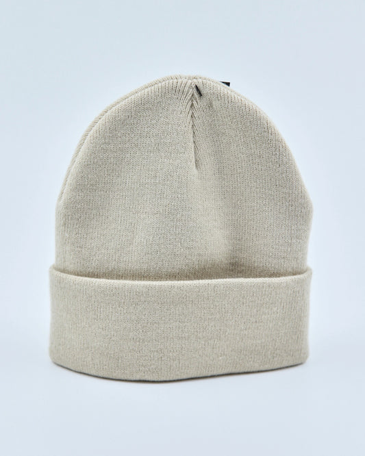 Ecru white beanie on a light gray background