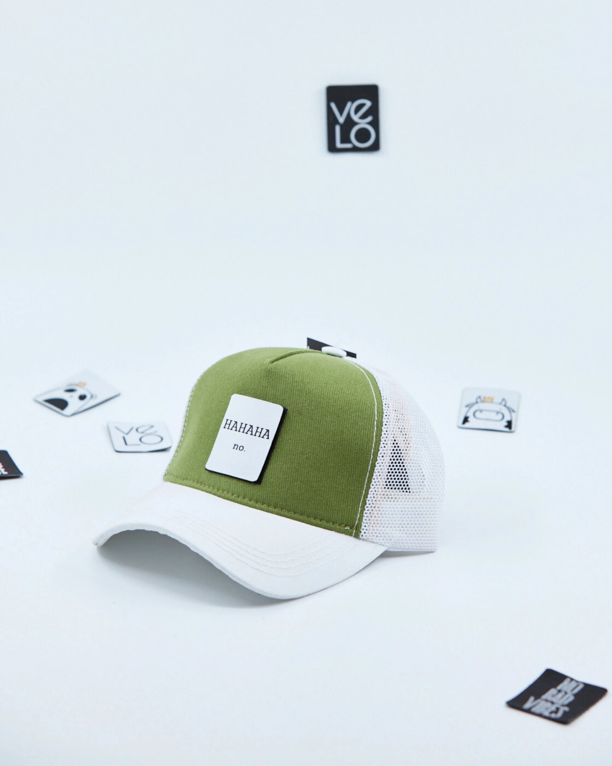 Side view of Green and White Trucker Cap with patches