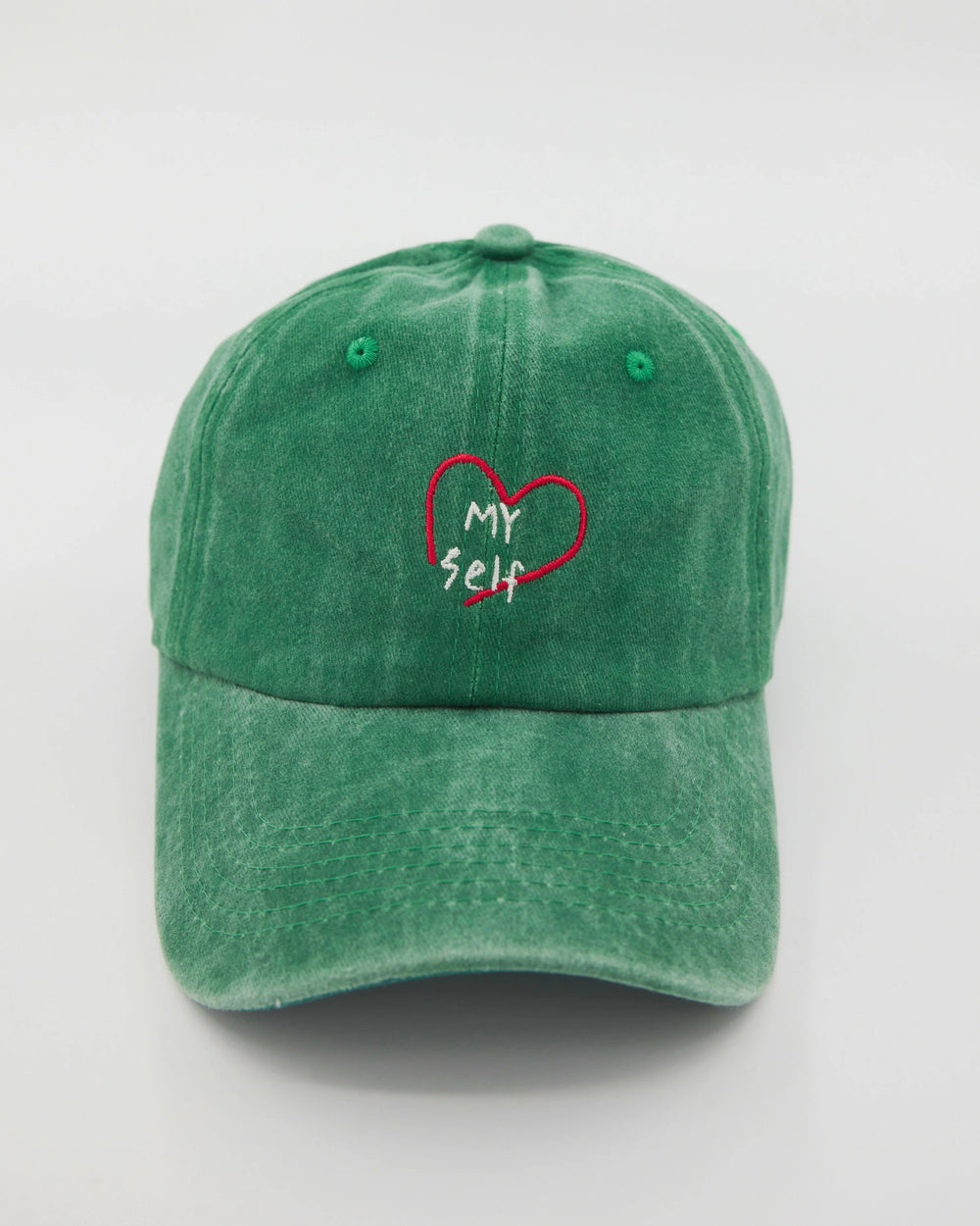 front view of green love myself washed cap