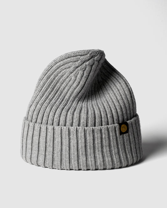 Grey Classic Beanie with a brand logo on a light gray background