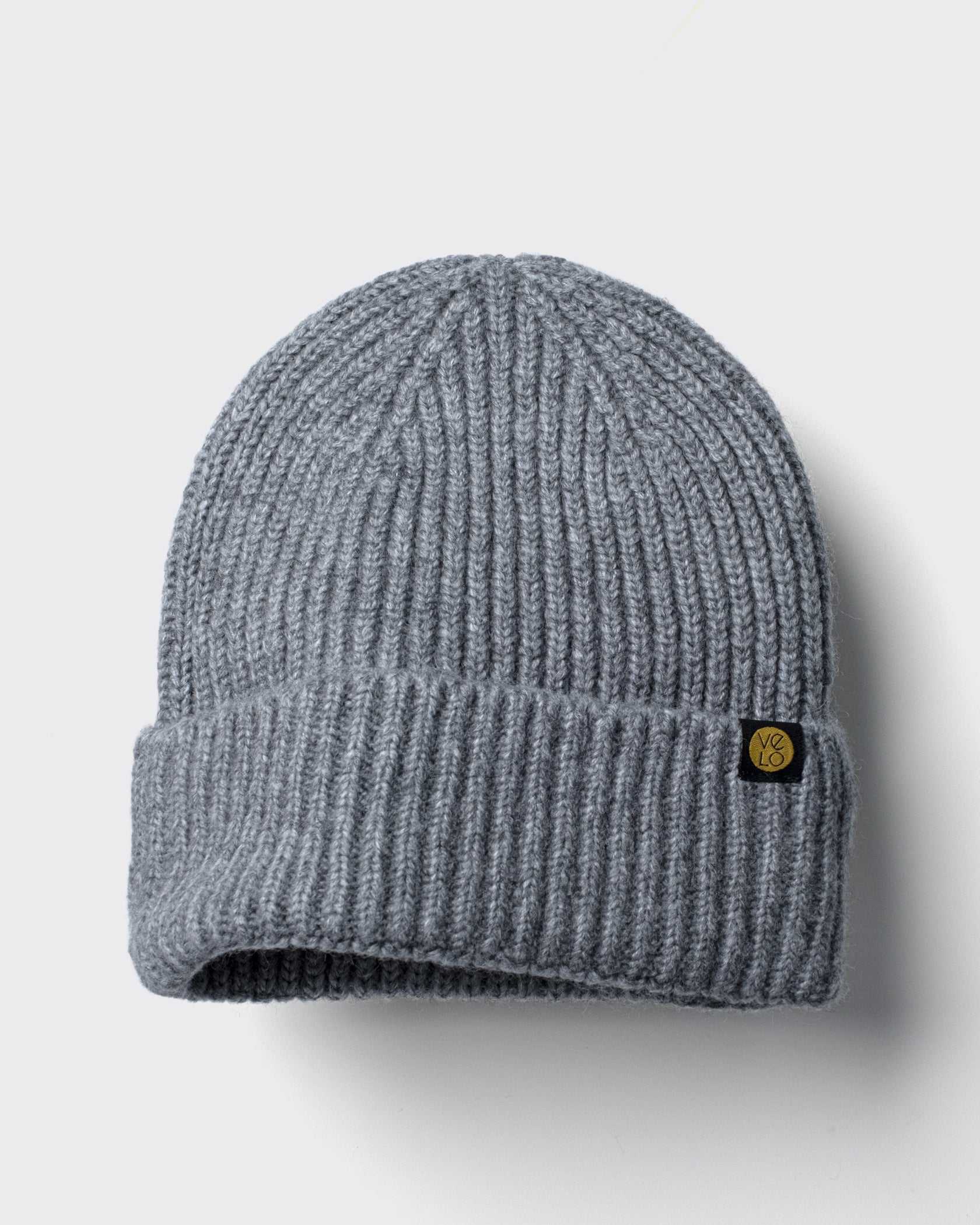 Grey Lux Beanie on a light gray background