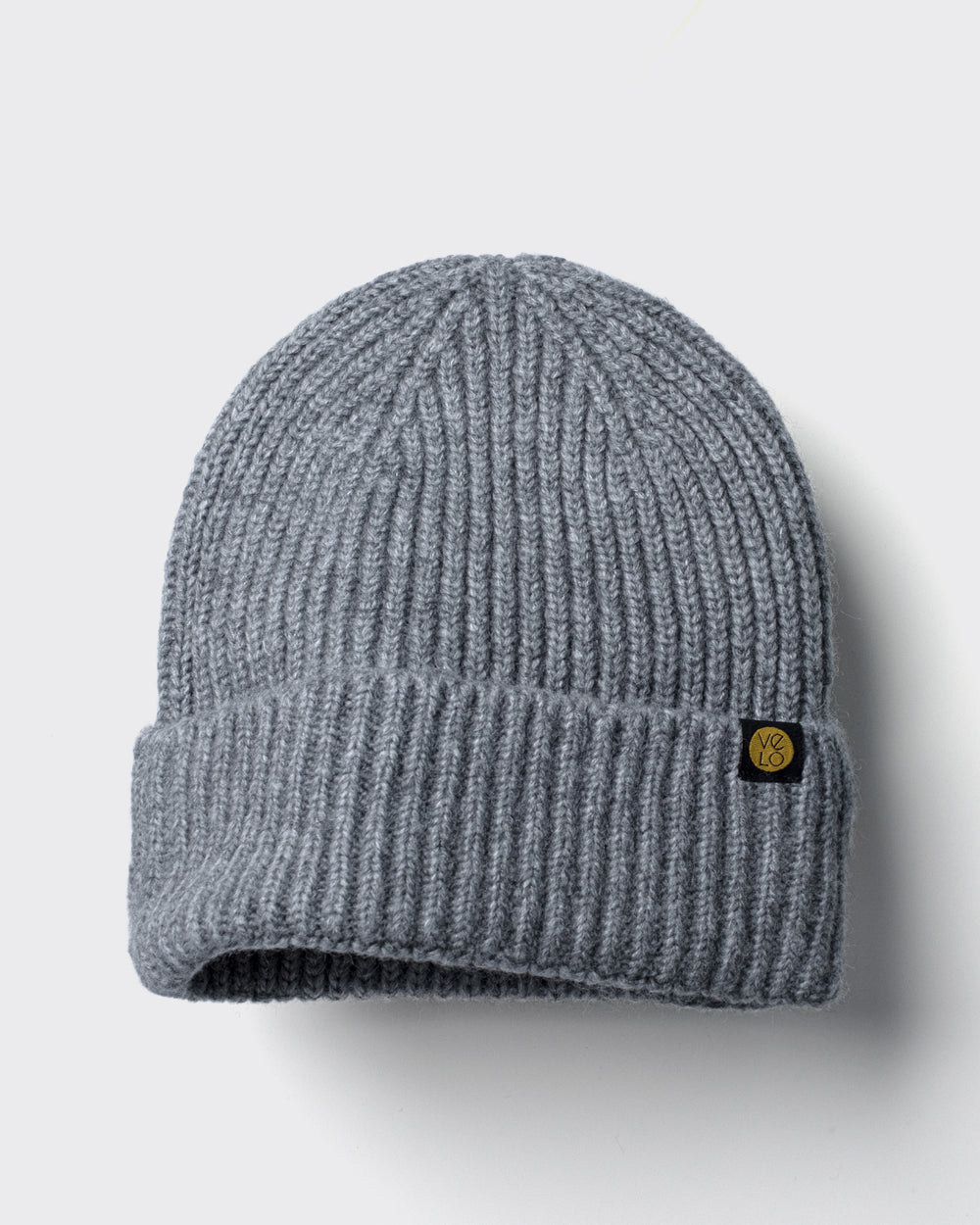 Grey Lux Beanie on a light gray background