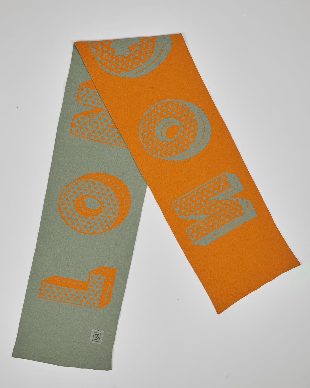 Hackney Sage unisex acrylic scarf flat lay in muted sage and burnt orange