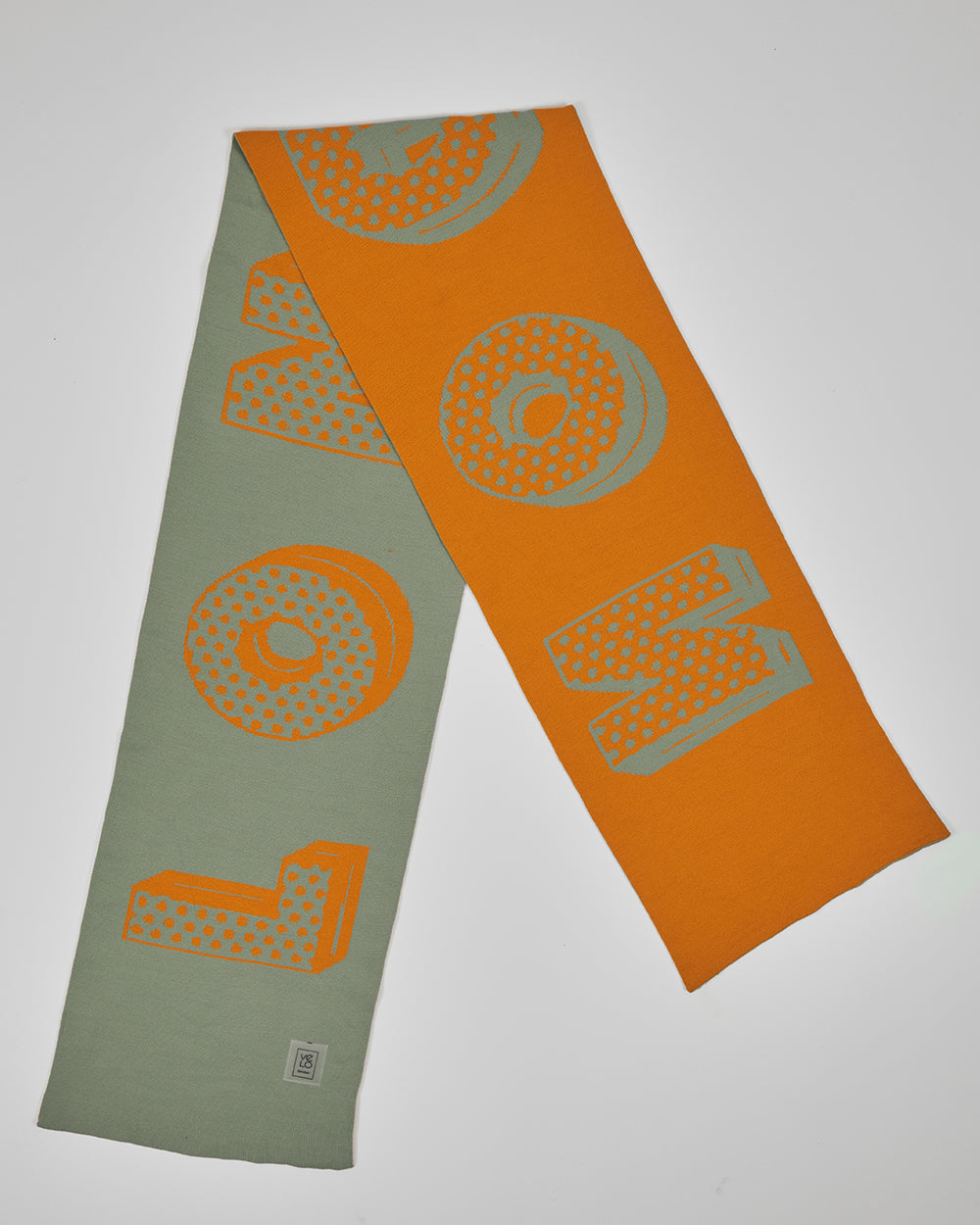 Hackney Sage unisex acrylic scarf flat lay in muted sage and burnt orange
