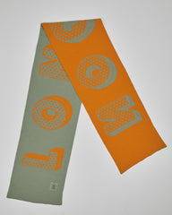 Hackney Sage unisex acrylic scarf flat lay in muted sage and burnt orange