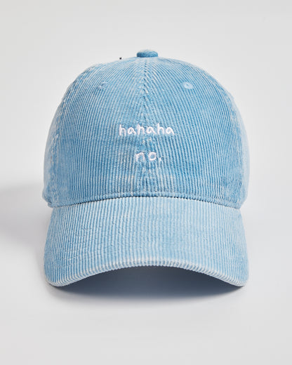 Light blue corduroy cap with 'hahaha no.' text on a white background