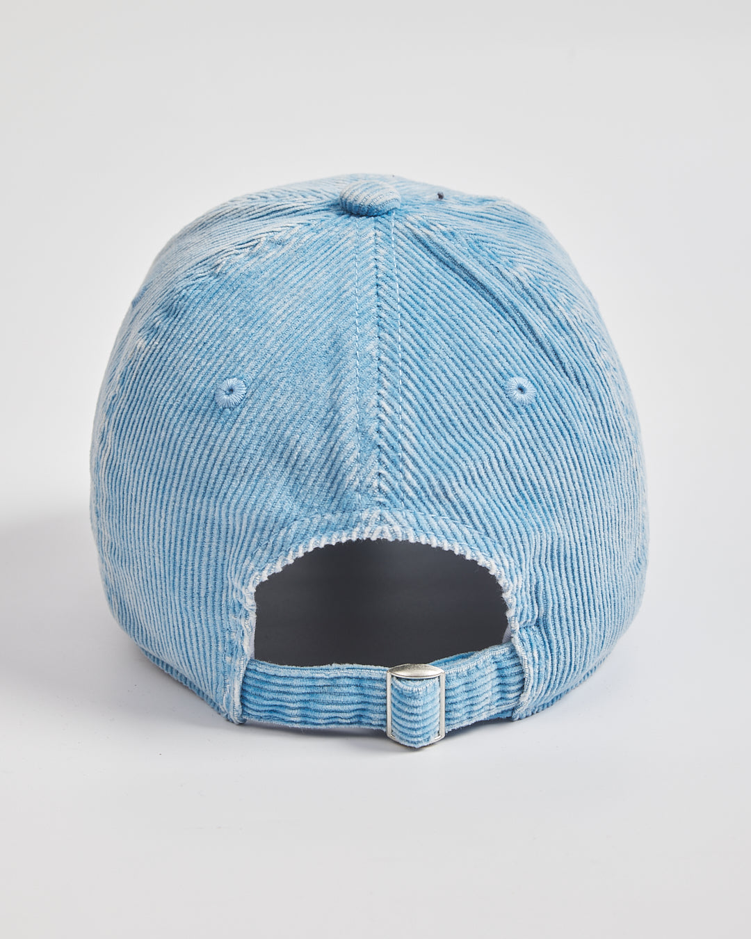 Back look of baby blue cap on a light gray background