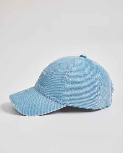 side look of baby blue cap on a light gray background