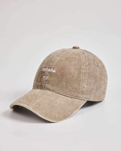 Beige corduroy cap with white text on a light gray background