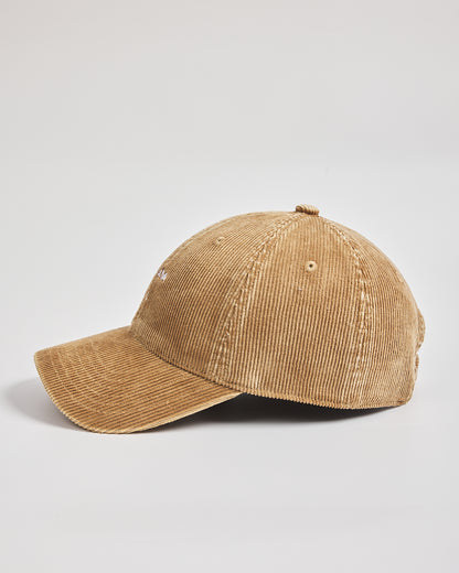 Camel yellow corduroy cap on a light gray background