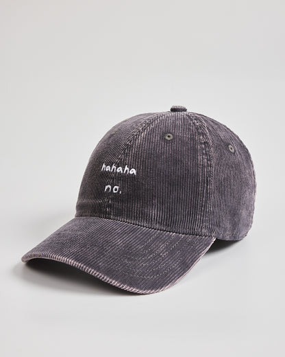 Charcoal grey corduroy cap with text on a light gray background