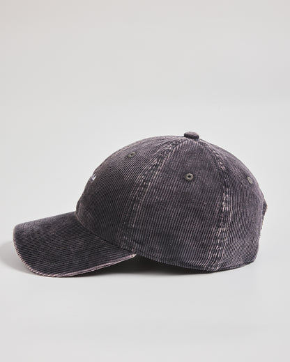 Charcoal grey corduroy cap on a light gray background