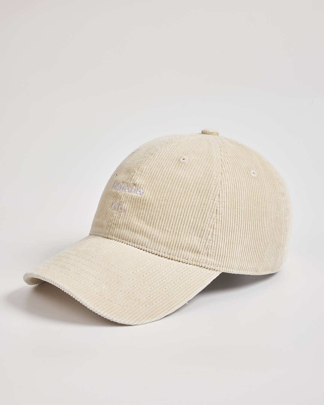 Beige cream corduroy cap on a light gray background