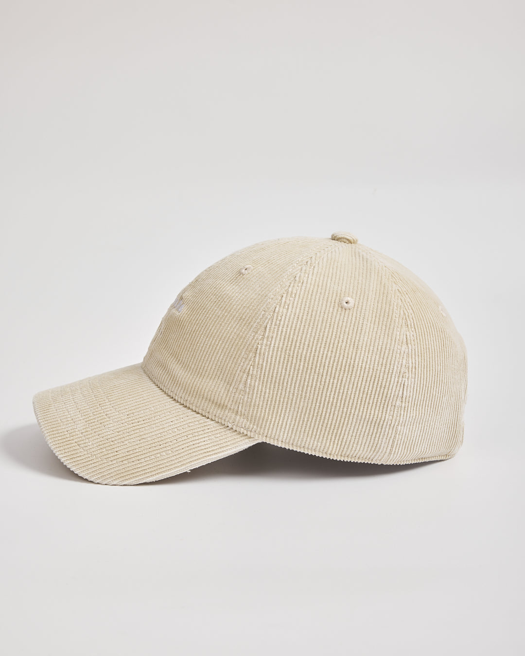Beige corduroy cap on a light gray background