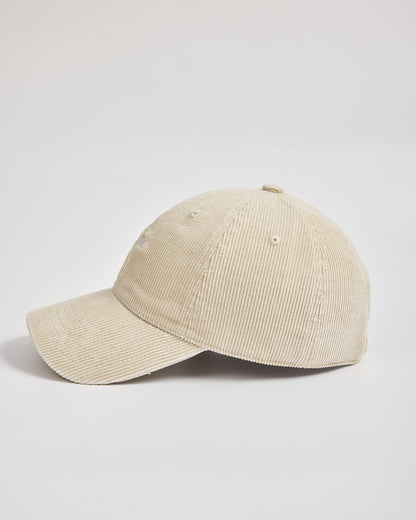 Beige corduroy cap on a light gray background