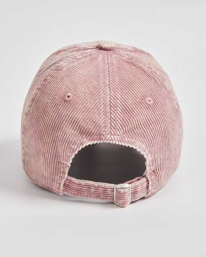 Pink corduroy cap on a light gray background