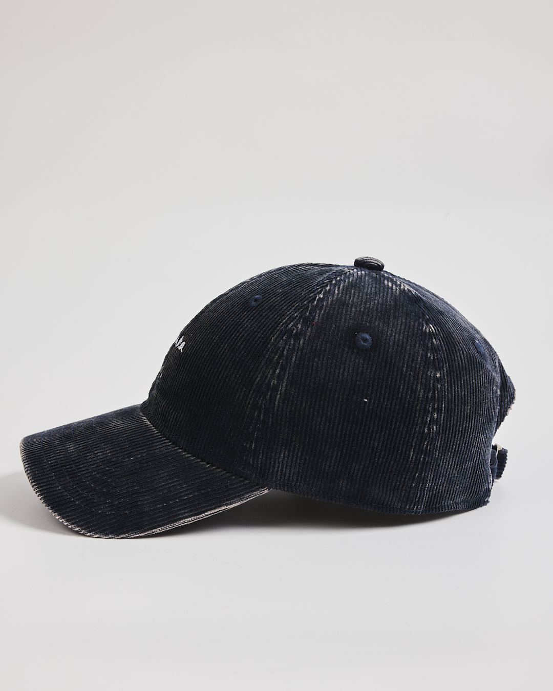 Navy blue corduroy cap on a white background