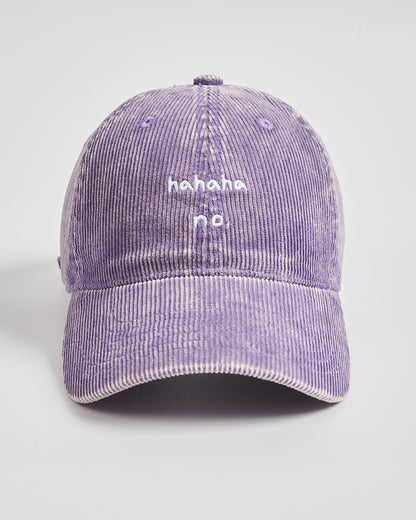 Purple corduroy cap with 'hahaha no.' text on a light gray background