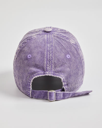 Purple corduroy cap on a light gray background