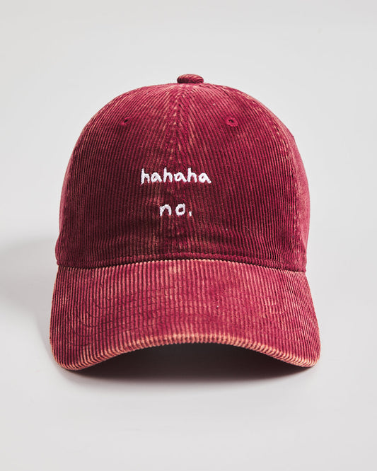 Hahaha No Red Corduroy Cap with white text on a light gray background