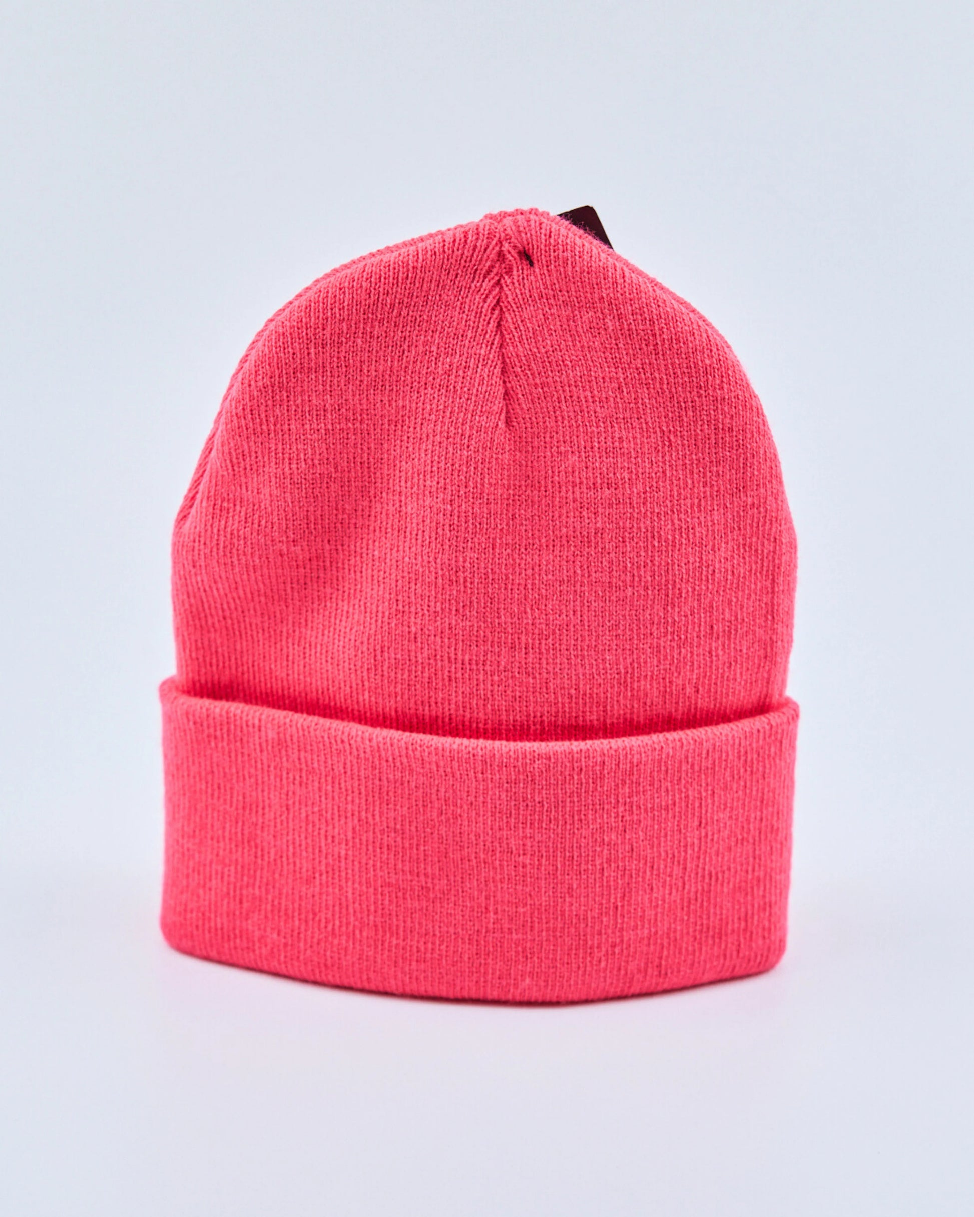 Hot pink beanie on a light gray background