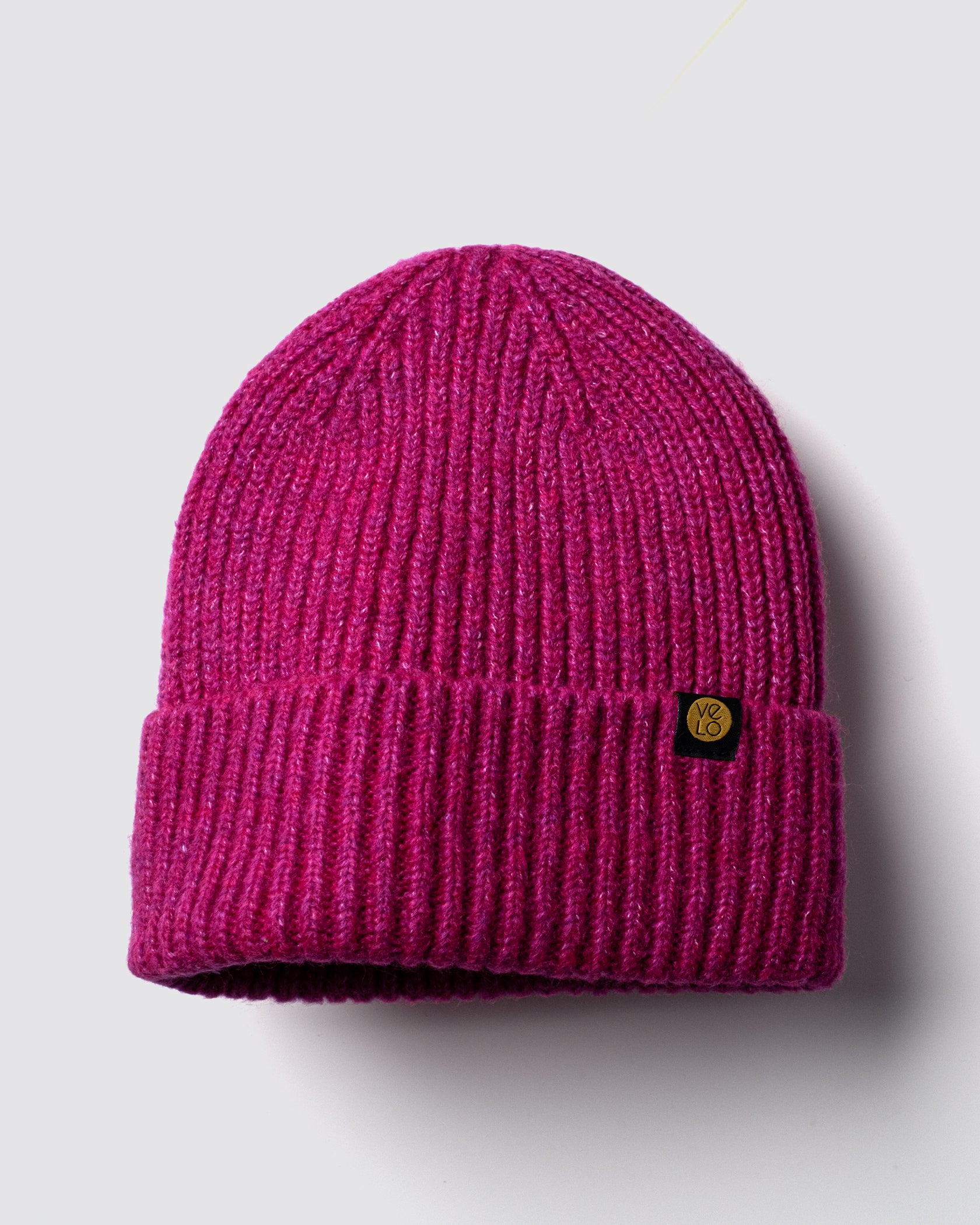 Hot Pink Lux Beanie on a light gray background