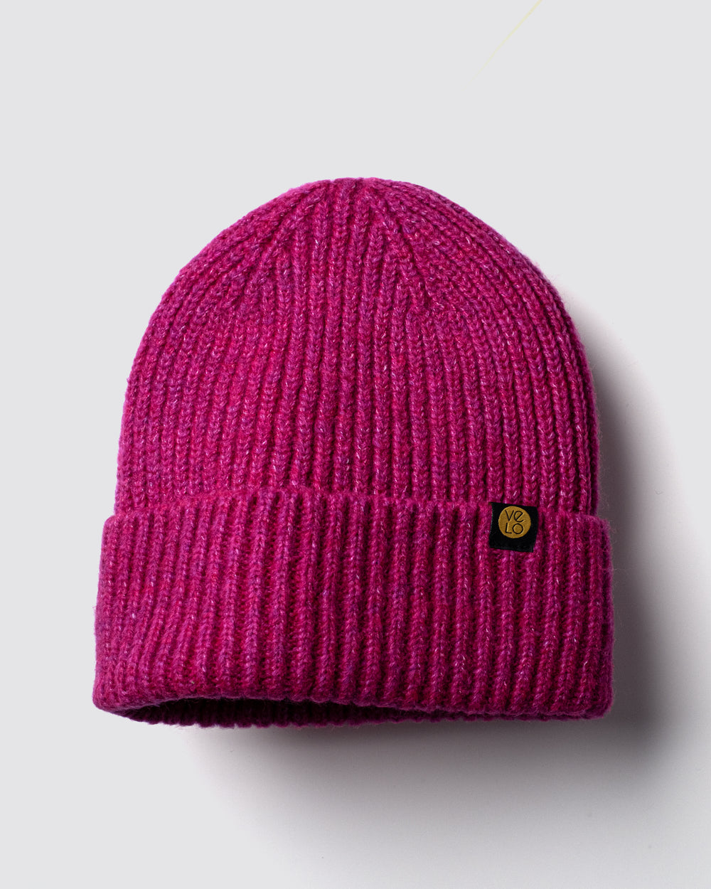 Hot Pink Lux Beanie on a light gray background