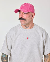 side view of a man wearing Shoreditch Hot Pink Washed Cap