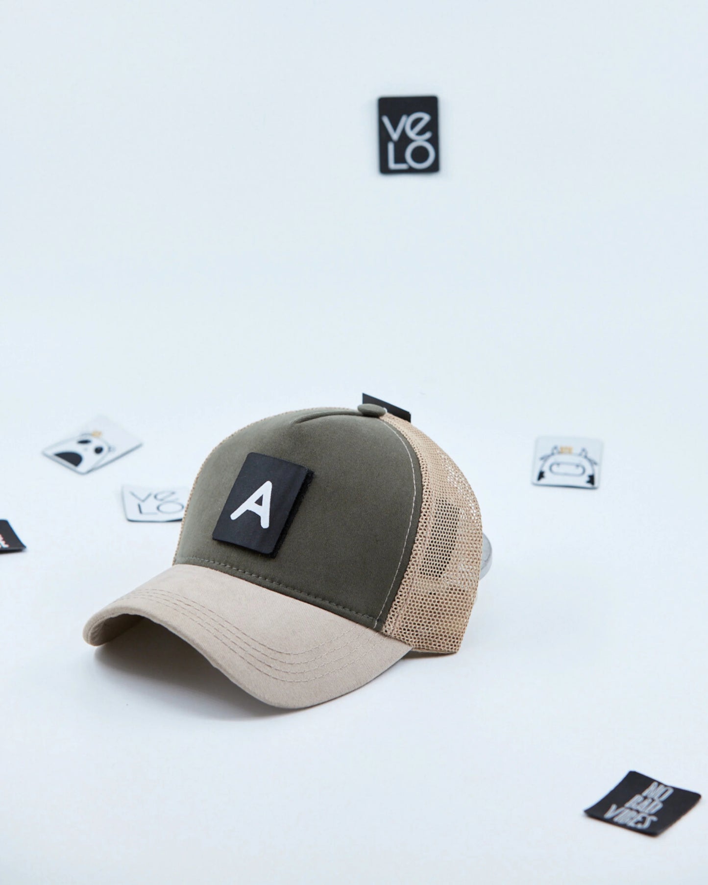 Side view of Khaki and Beige Customisable Trucker Cap with patches