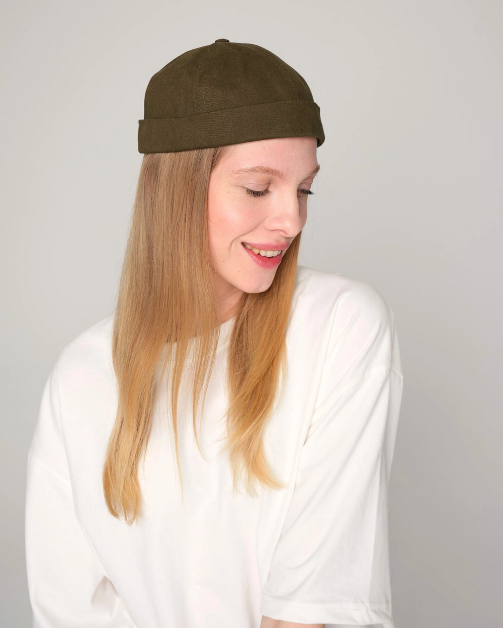 woman wearing khaki docker cap