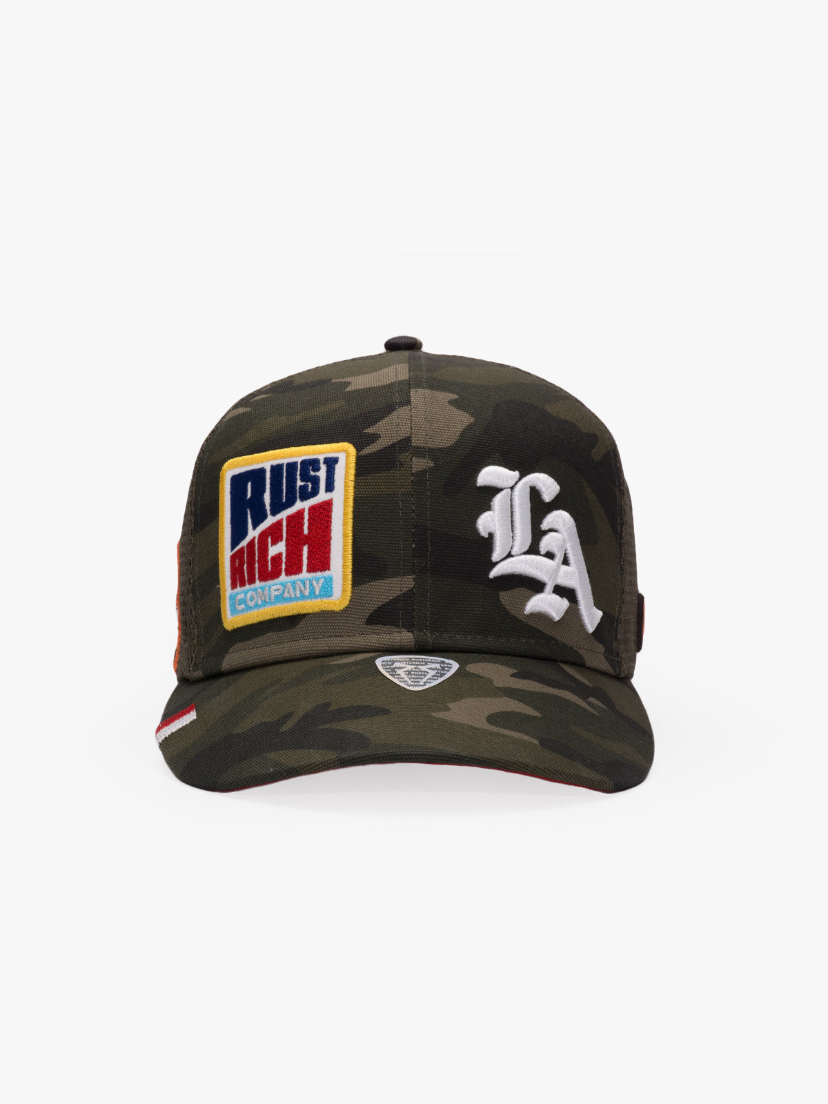 Camouflage baseball cap with patches on a white background