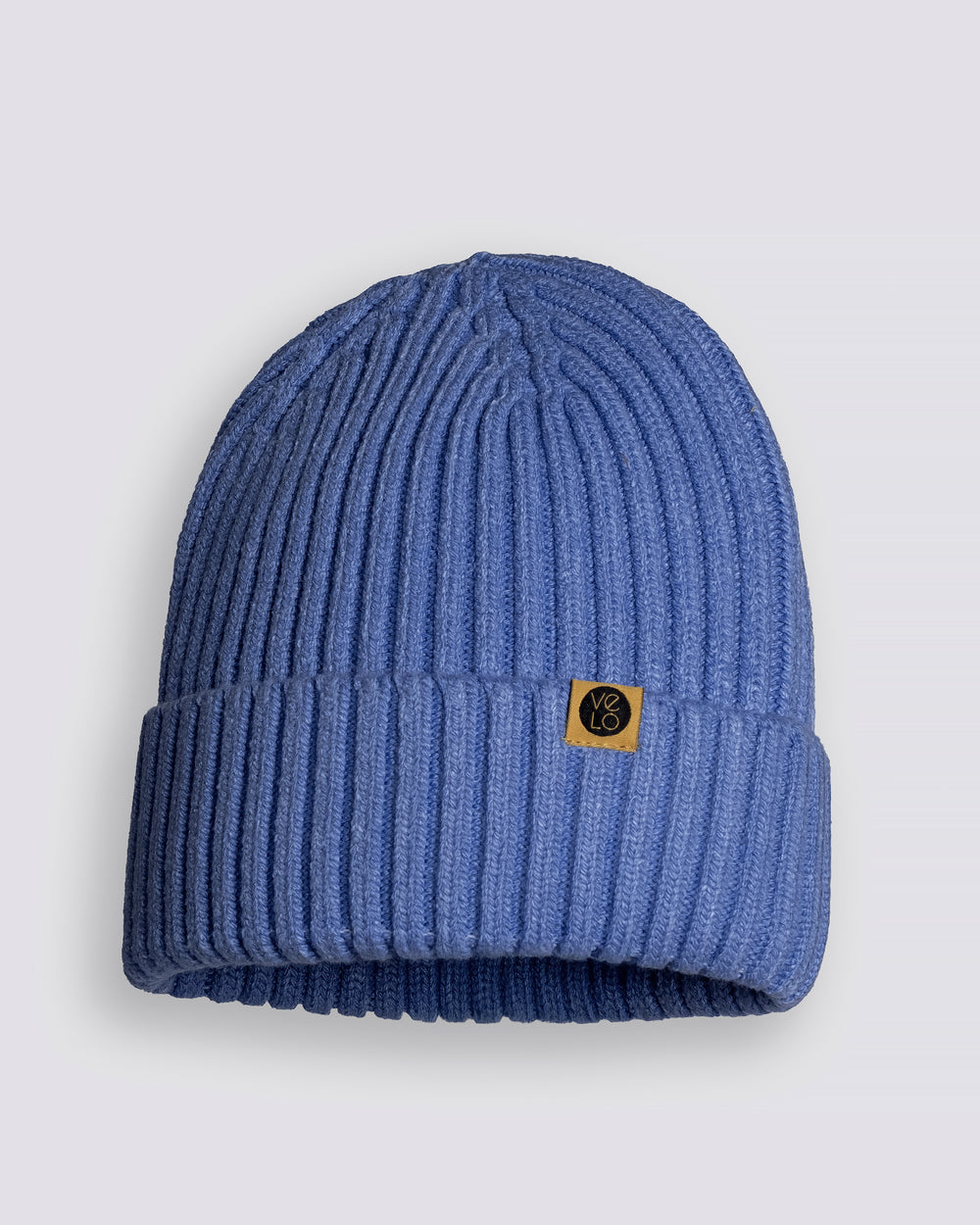 Light blue knit beanie with a brand logo on a light gray background