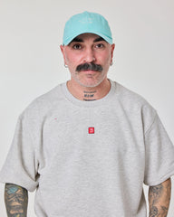 man wearing Cute But Psycho Light Blue Washed Cap