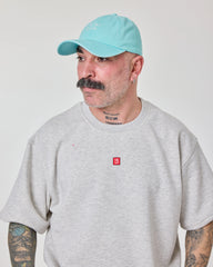 man wearing Cute But Psycho Light Blue Washed Cap Hat