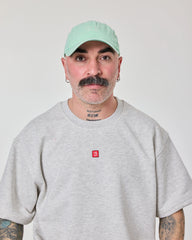 man wearing Cute But Psycho Light Green Cap Hat