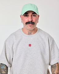 front view of a man wearing Shoreditch Light Green Washed Cap