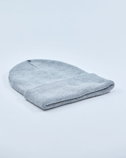 Gray knit beanie on a light gray background