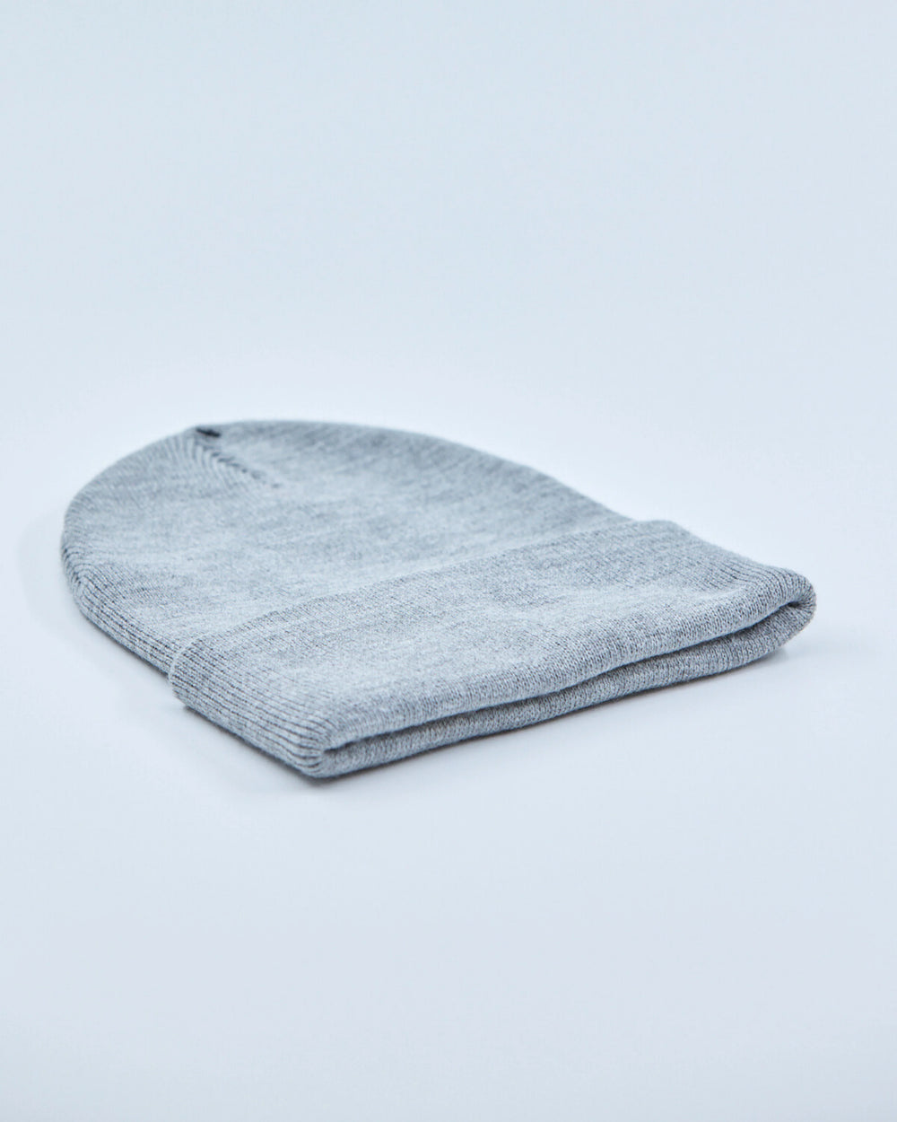 Gray knit beanie on a light gray background