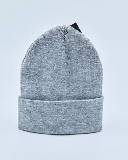 Light gray beanie on a light blue background