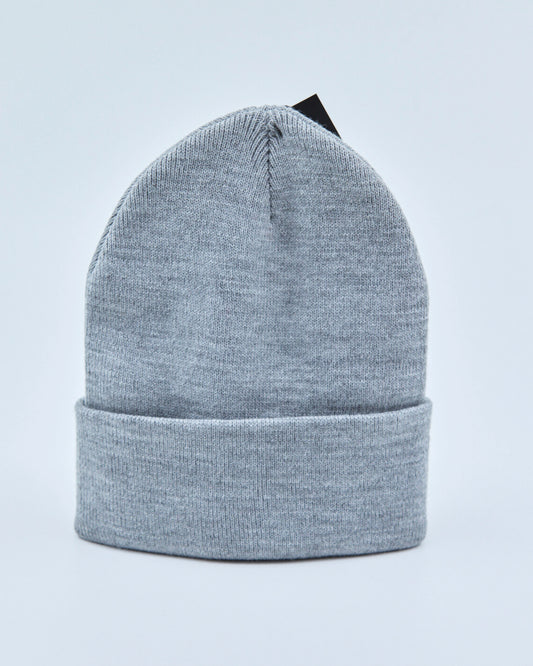 Light gray beanie on a light blue background